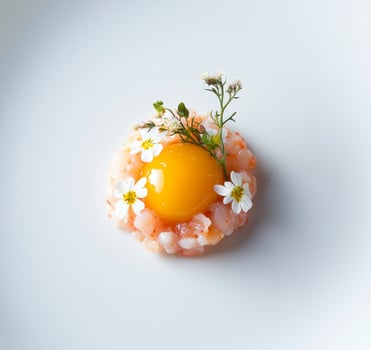 A small dish with an egg and flowers photo