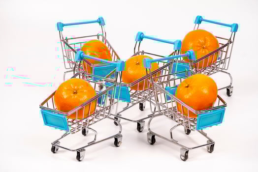 Shopping carts filled with oranges create a colorful display photo