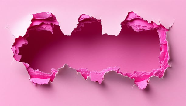 A hole in the wall with pink paper photo