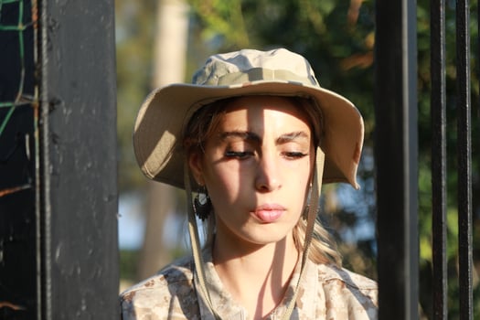 Young Woman Soldier Escaping From Prison photo