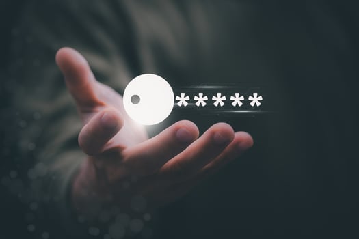 a person holding a key with a group of people on it photo