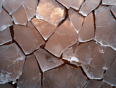 Abstract background of cracked ice pieces on a surface photo