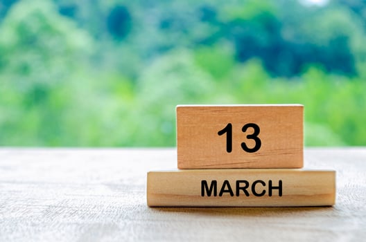 13 March calendar on wooden table with customizable space for text, ideas or messages. Calendar and copy space concept photo