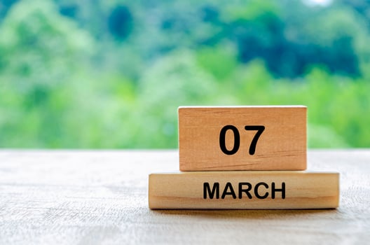7 March calendar on wooden table with customizable space for text, ideas or messages. Calendar and copy space concept photo