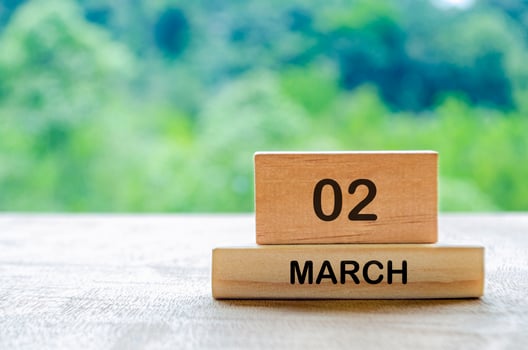 2 March calendar on wooden table with customizable space for text, ideas or messages. Calendar and copy space concept photo