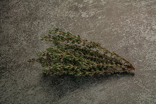 A bunch of herbs on a table photo