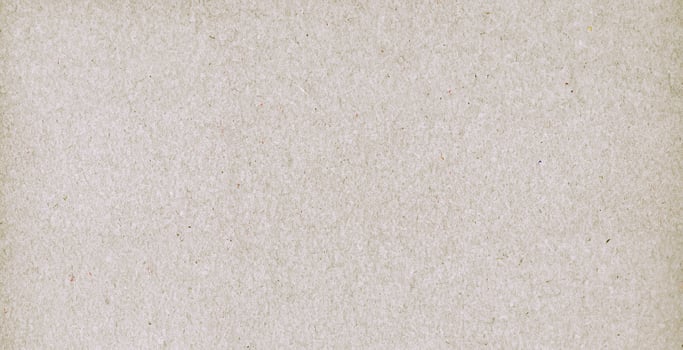 Close-up of a natural recycled paper texture with subtle fiber patterns, ideal for design and crafting projects. photo