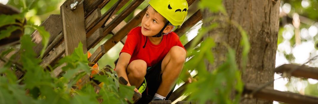 Brave kids climbs in rope park, playground photo