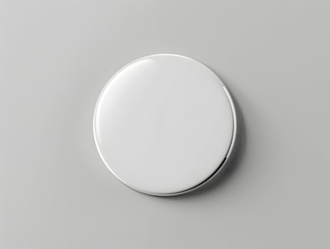 A white round object on a gray surface photo