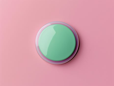A green button on a pink background photo