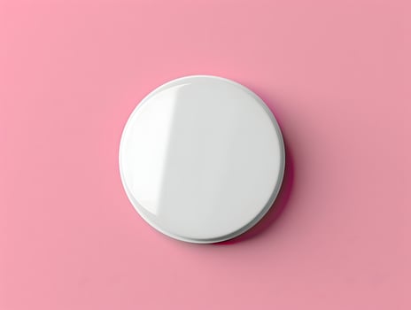 A white toilet seat on a pink background photo