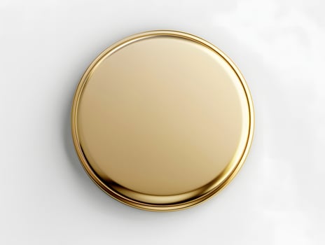 A gold button on a white surface photo