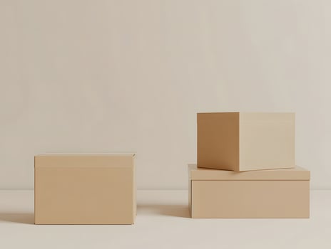 Three cardboard boxes on a white surface photo