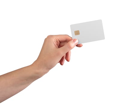Hand holding blank credit card with gold chip, mockup for finance, banking, or payment design. photo