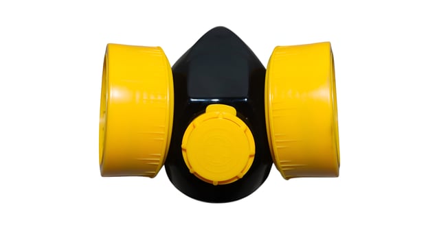Protective gas mask with vibrant yellow filters for industrial safety photo