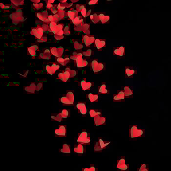 Falling Red Heart Shapes Over Black Background, Representing Love and Affection photo