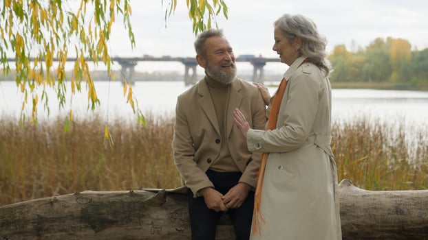 Caucasian old retired married couple in love mature senior man woman grandparents happy family talk relax rest together romantic weekend nature outdoors relaxed male female affectionate relationship photo