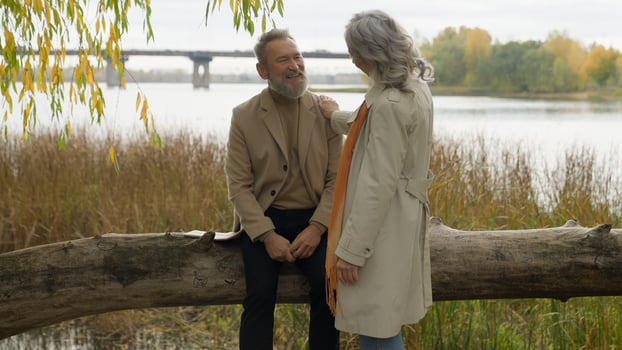 Caucasian old retired married couple in love mature senior man woman grandparents happy family talk relax rest together romantic weekend nature outdoors relaxed male female affectionate relationship photo