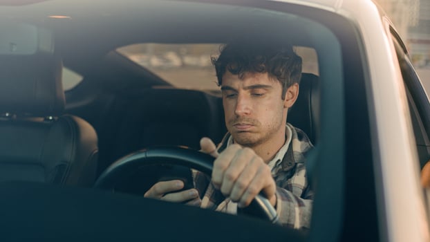 Disappointed stressed sad man Caucasian auto driver businessman inside automobile car waiting in traffic jam using mobile phone read bad news upset displeased loss gps navigation road driving in city photo