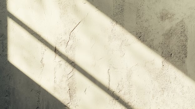 Light Streaks Across Textured Wall with Creamy Color and Soft Shadows photo
