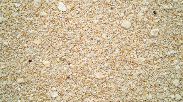 Close-up of Beige Crushed Rock Texture for Construction Materials photo