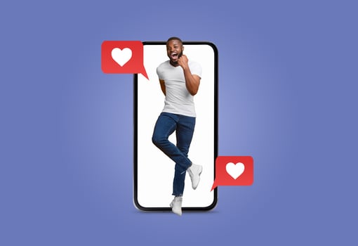 A person joyfully interacts with a smartphone, showcasing the thrill of receiving love messages on social media. The vibrant backdrop adds to the festive mood of Valentine's Day. photo