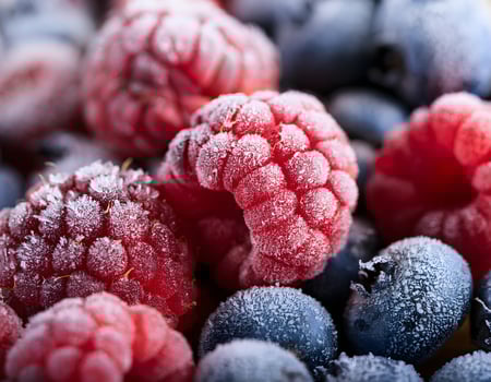 Frozen Berry Medley. Frosted Raspberries, Blueberries, and Blackberries photo