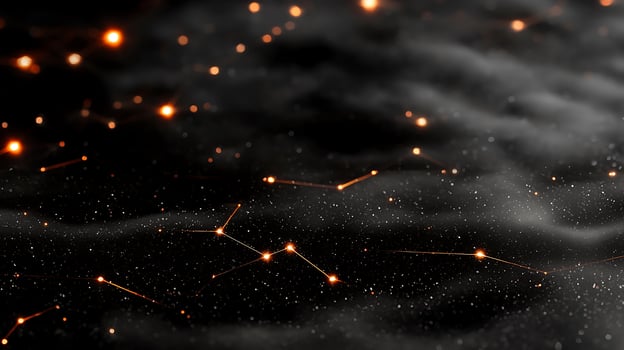 A black background with stars and orange lights photo