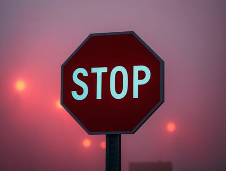 A Stop sign isolated on a hazy background, and electric vivid colors photo