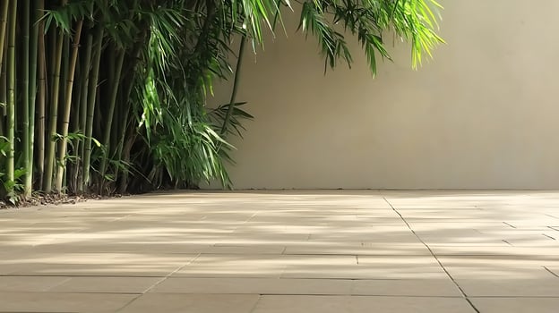 A tiled floor with a bamboo plant in the background photo