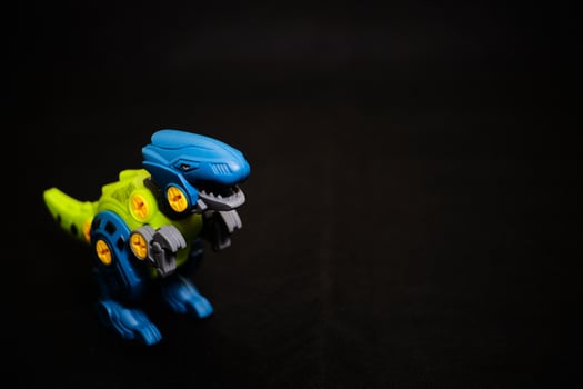 Robot T-Rex Toy on Dark Background - Mechanical Dinosaur photo