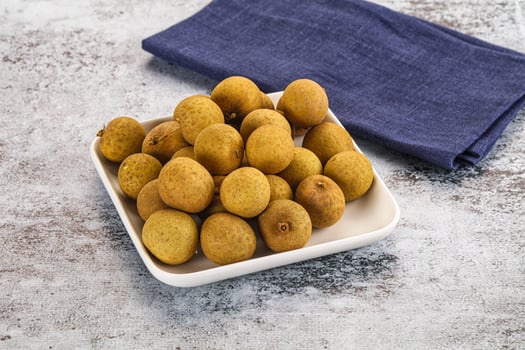 A bowl of kiwis on a table photo