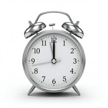 An alarm clock is shown on a white background. photo