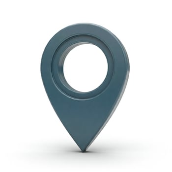 A blue pin with a circle on it photo