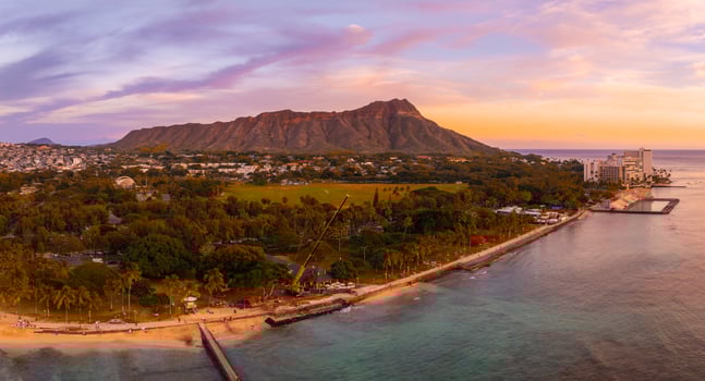Aerial View of Diamond Head Crater and Beach at Sunset in Oahu photo