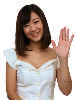 Asian woman waving her hand with a smile photo