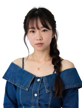 A woman in a denim top and braids photo