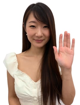 A woman with long hair and a white shirt is showing her hand photo