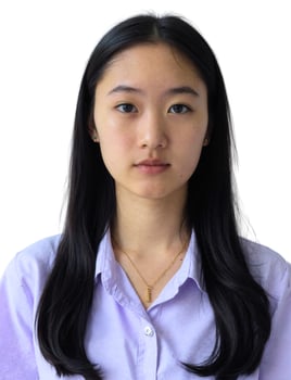 A young woman with long black hair and a purple shirt photo