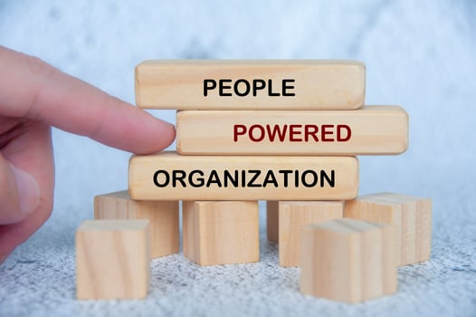 People Powered Organization text on wooden blocks. People first concept photo