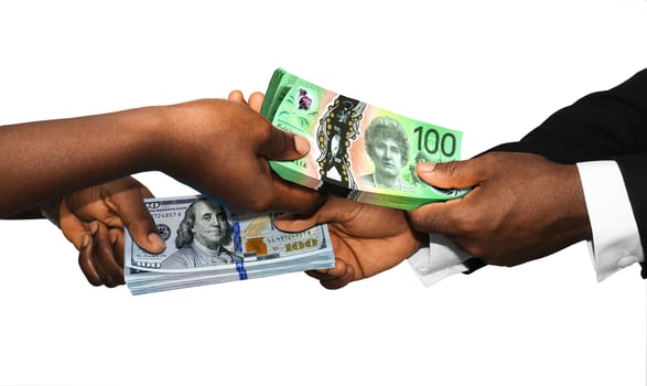 Two black african people hands holding exchanging stacks Australian Dollar USA Dollar currrency notes on white background. pairing, Weighing and comparing two country monies. Exchange rate concept photo