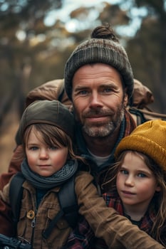 A man and two children are posing for a photo