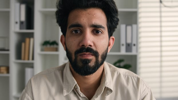 Male portrait in office calm tranquil 30s bearded business man adult businessman professional leader boss manager employer entrepreneur architect Indian Arabian muslim ethnic guy millennial in office photo