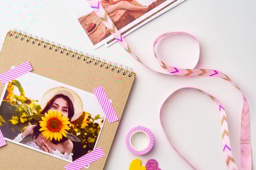 Creative scrapbook layout featuring vibrant photos and decorative crafting supplies