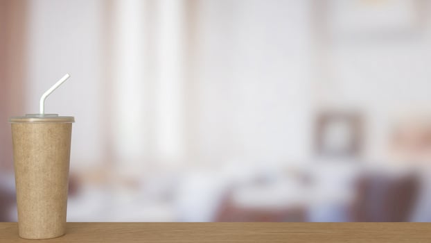 Coffee paper cup on wood Table. photo