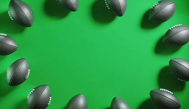 American Footballs Frame on Green Background photo