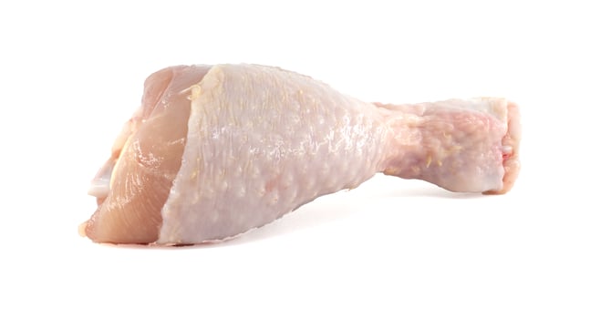 Raw chicken leg isolated on white background photo