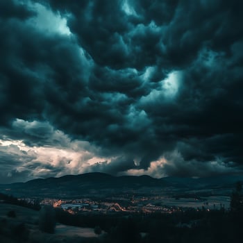 Storm clouds over a city at night photo