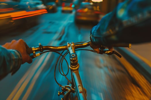 A person riding a bicycle on a city street photo