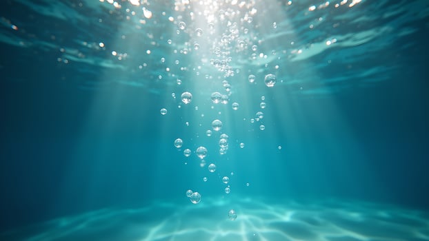 Underwater Bubbles with Sun Rays in Ocean Depth photo